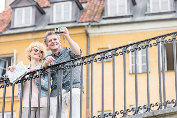 Happy middle-aged couple taking selfie