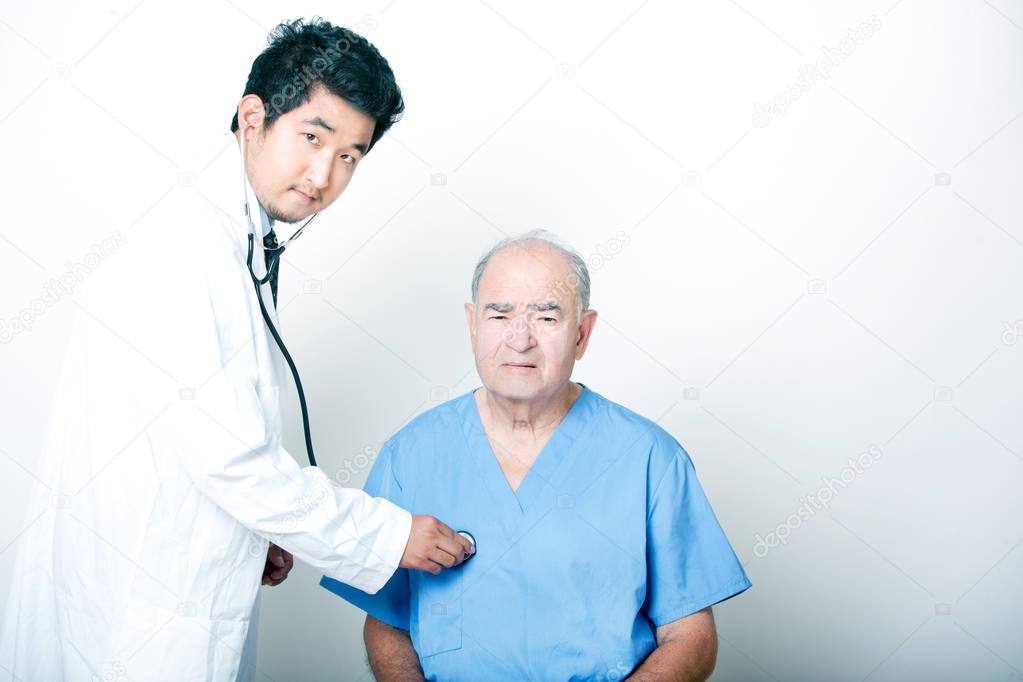 Asian Doctor comforting a Senior patient