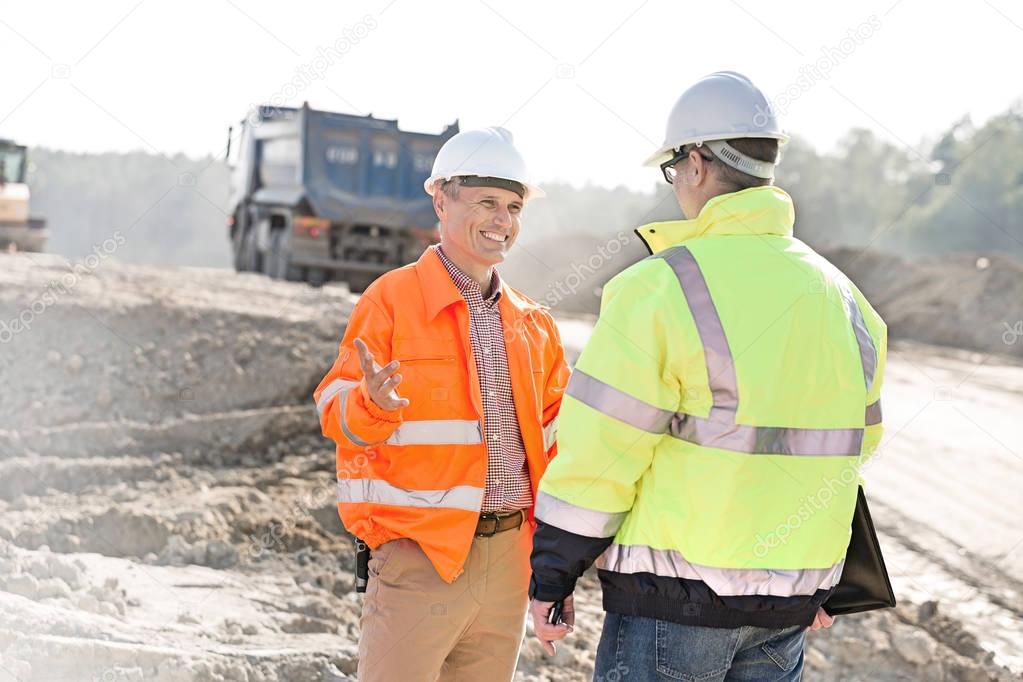 Happy engineers at construction site