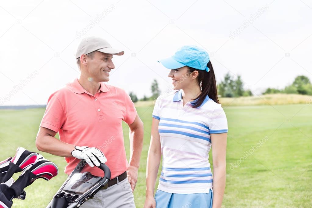 Couple playing golf 