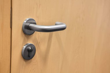 Closed door with doorknob clipart