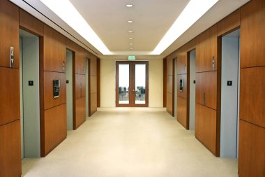 Empty hallway between elevators clipart