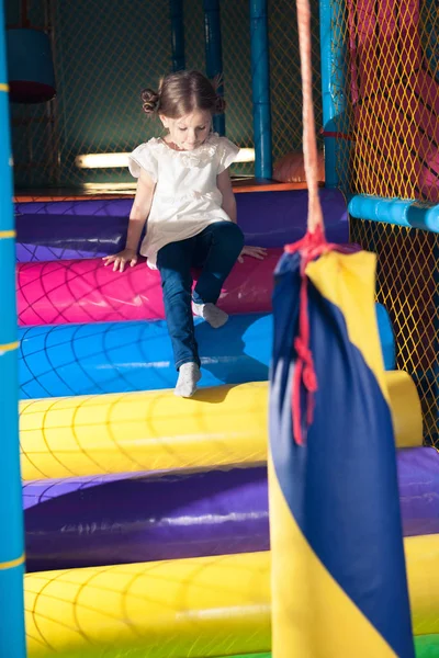 Little girl in play gym — Stock Photo, Image