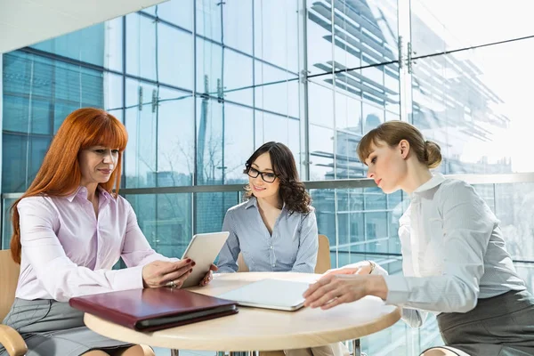 Businesswomen using digital tablet — Stock Photo, Image