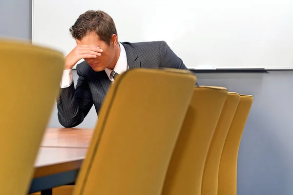 Despaired businessman sitting — Stock Photo, Image