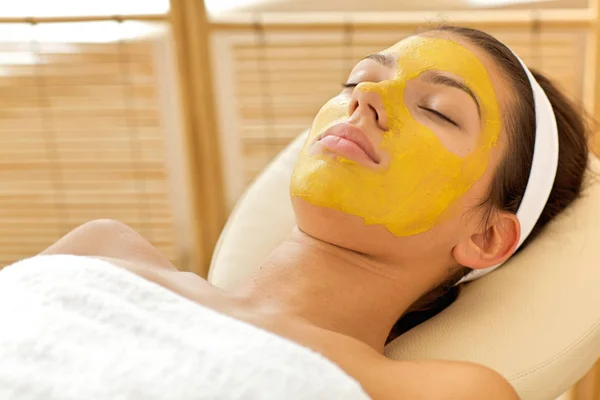 Woman wearing facial mask — Stock Photo, Image