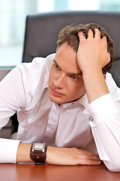 Businessman with head in hands — Stock Photo, Image