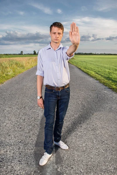 Serious man showing stop gesture — Stock Photo, Image
