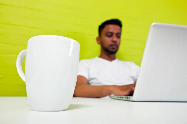 Indian man working at desktop — Stock Photo, Image