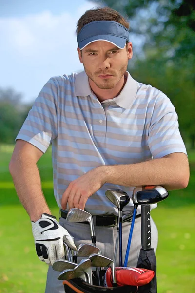 Man standing by golf bag — Stock Photo, Image