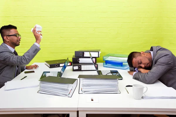 Businessman throwing paper at twin — Stock Photo, Image