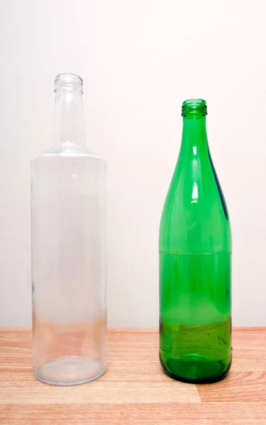 Green and clear glass bottles — Stock Photo, Image