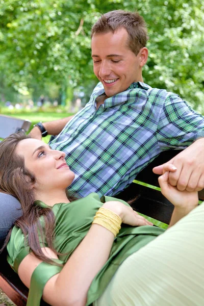 Girlfriend resting head on boyfriend's lap — Stock Photo, Image