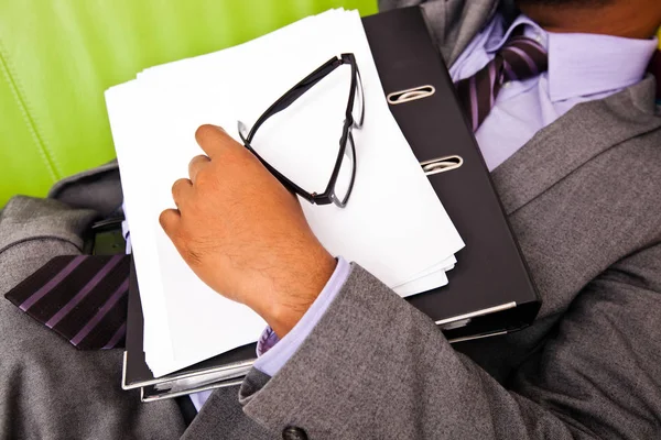 Sleeping businessman holding folder — Stock Photo, Image