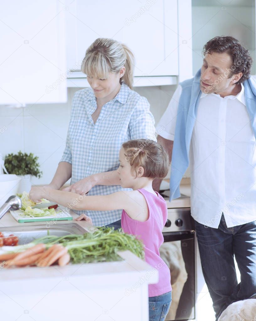 Family making healthy salad