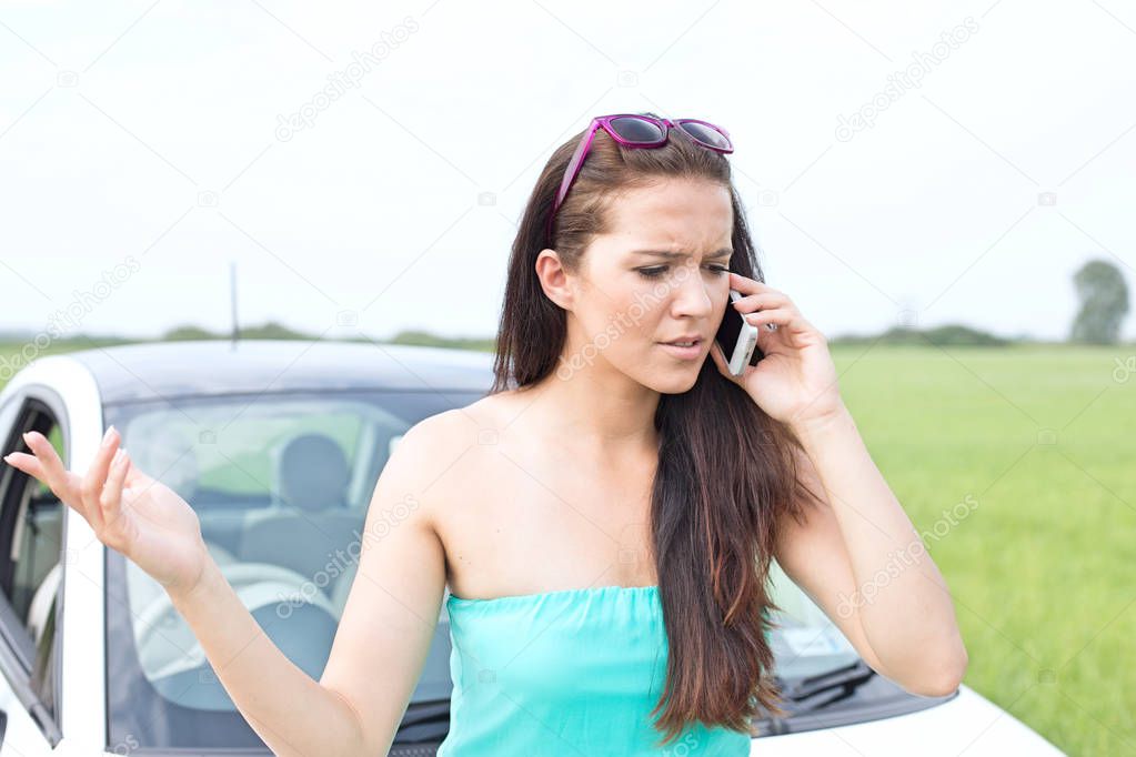 Frustrated woman using cell phone