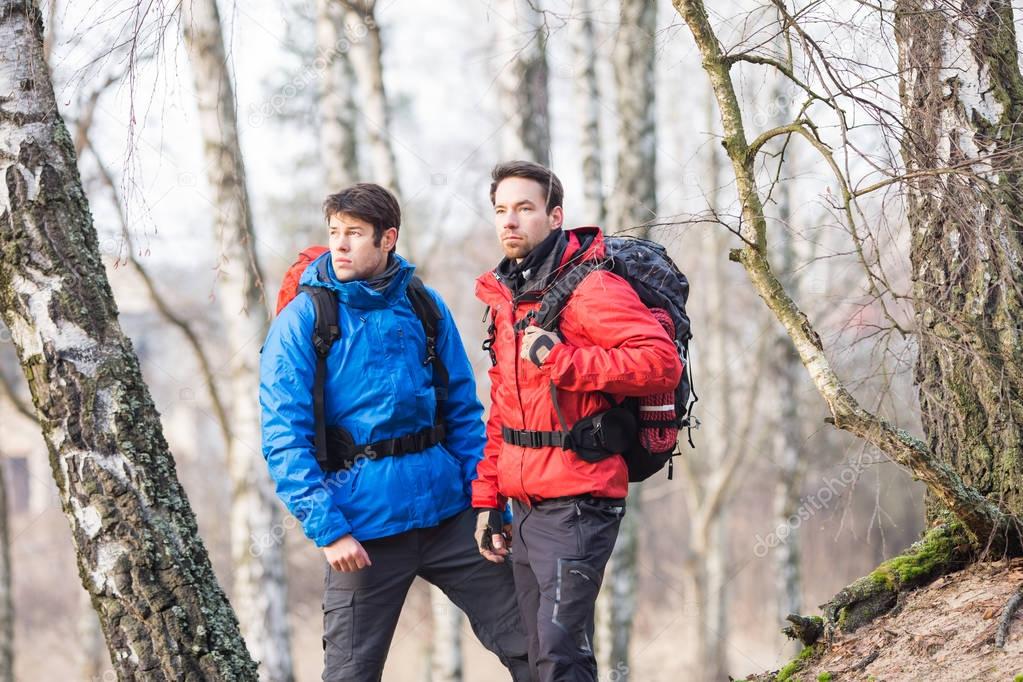 male hikers in forest