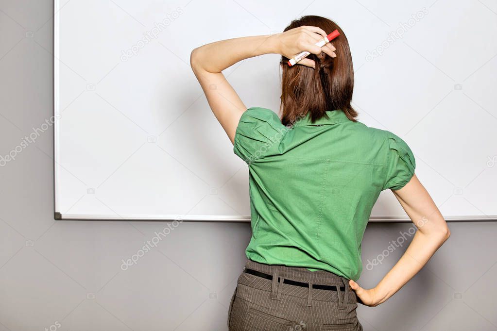 Businesswoman standing in front of whiteboard 