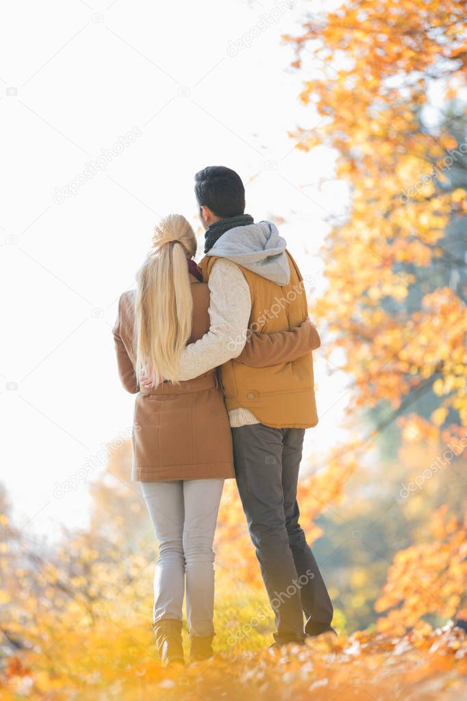 couple in park during autumn