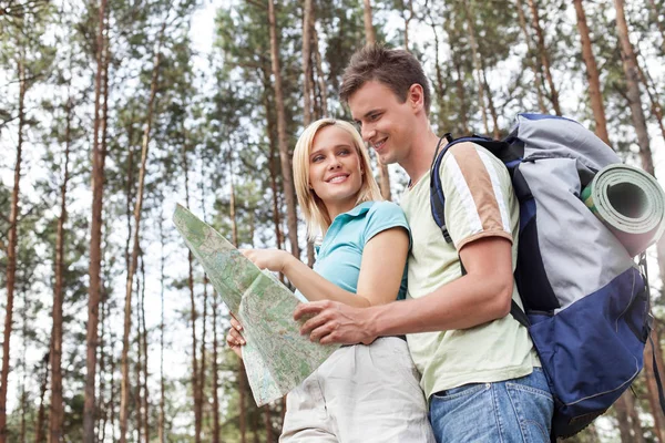 hiking couple reading map