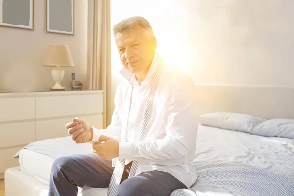 Portrait Senior Man Buttoning His Sleeves While Sitting Bed Home — Stock Photo, Image