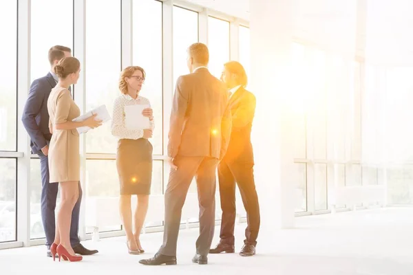 Business Colleagues Discussing While Standing Window New Office — Stock Photo, Image