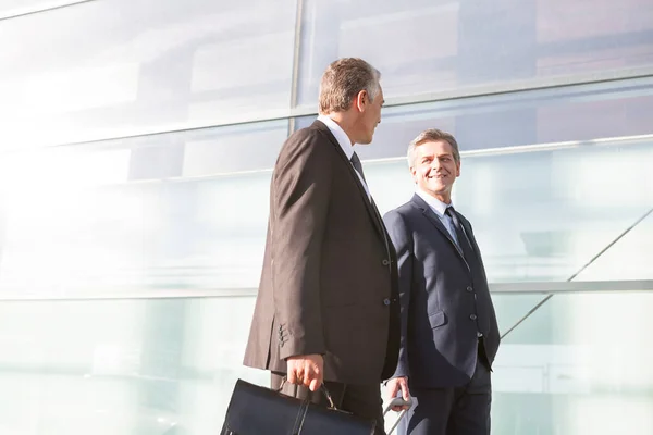 Mature Businessmen Walking While Talking Airport — Stock Photo, Image