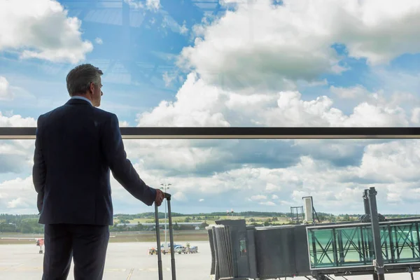 Portrait Mature Businessman Standing His Suitcase While Looking Window Airport — Stock Photo, Image