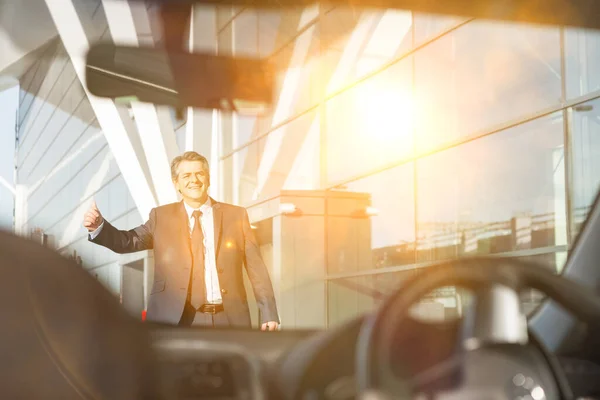 Portrait Mature Businessman Calling Taxi Airport Yellow Lens Flare — Stock Photo, Image
