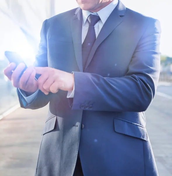 Portrait Mature Businessman Using Smartphone Airport Lens Flare — Stock Photo, Image