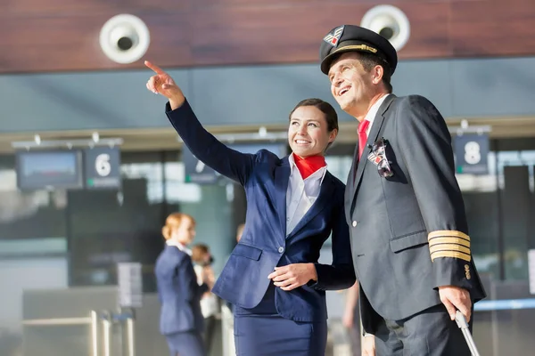 Young Attractive Stewardess Pointing Aircraft Pilot Airport — Stock Photo, Image