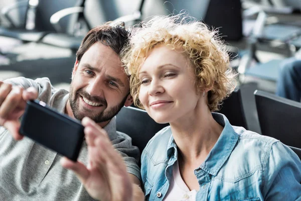 Portrait Mature Couple Taking Selfie While Waiting Boarding Airport — Stock Photo, Image