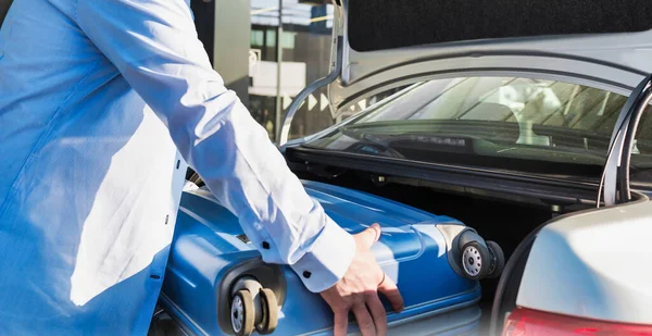 Portrait Mature Businessman Putting His Luggage Car Trunk Lens Flare — Stock Photo, Image