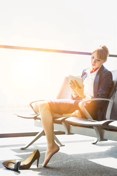 Young Beautiful Airport Staff Using Digital Tablet While Sitting Chair — Stock Photo, Image