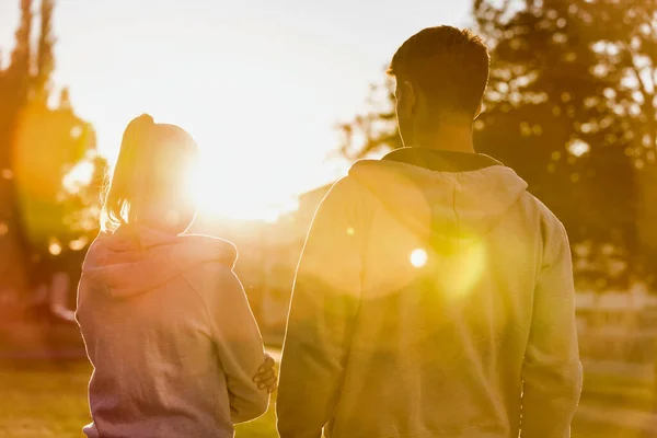 Man Embracing Her Girlfriend Work Out Park Lens Flare — Stock Photo, Image