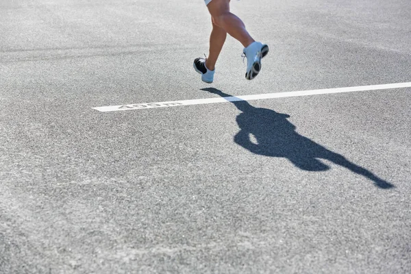 Man standing on 400 meter dash