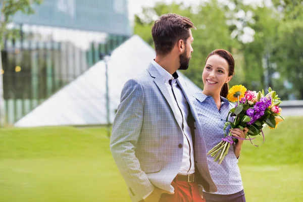 Young Attractive Business Couple Walking Park While Woman Holding Bouquet — Stock Photo, Image