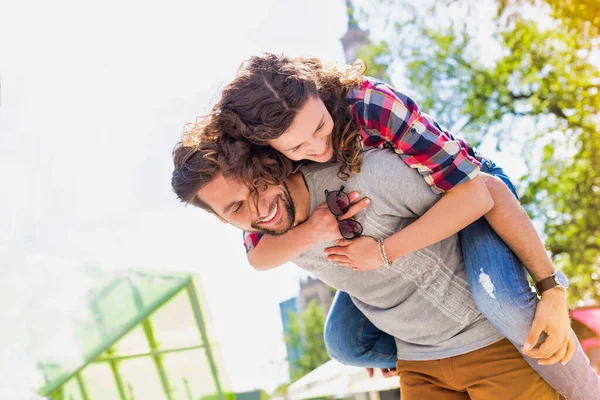 Portrait Young Attractive Man Giving His Girlfriend Piggy Ride Back — Stock Photo, Image