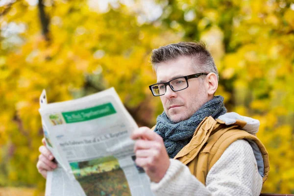 Portrait Mature Attractive Man Sitting Bench While Reading Newspaper Park — Stock Photo, Image