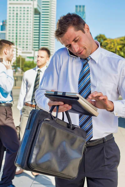 Portrait Handsome Mature Businessman Talking Smartphone Checking Appointment Digital Tablet — Stock Photo, Image