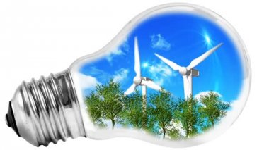 Ampul yeşil çim ve içinde bir yel değirmeni