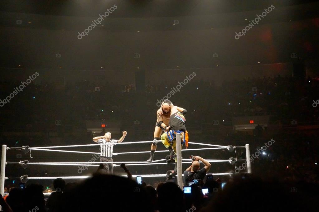 HONOLULU - JUNE 29, 2016: WWE wrestlers Karl Anderson setup a superplex to Uso on top rope of ring during match at WWE event at the Neal S. Blaisdell Center, Honolulu on June 29, 2016 Honolulu, Hawaii.