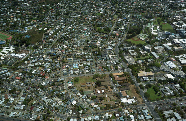 HONOLULU - APRIL 20, 2016: Aerial view of Landmark University of Hawaii, Mid Pacific institute, and surround neighborhood in Manoa in Honolulu, Hawaii April 20, 2016.