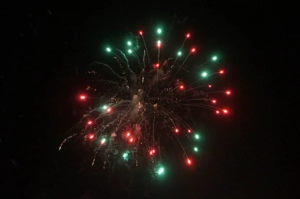 Red and Green Fireworks Burst into the Air — Stock Photo, Image