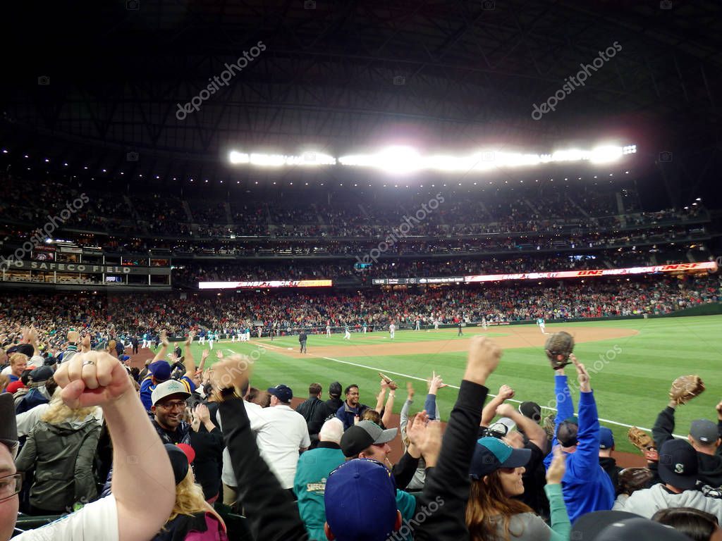 SEATTLE - JUNE 24: Fans cheer home team Mariners winning game at Safeco Field baseball game, Seattle in June 24, 2016.