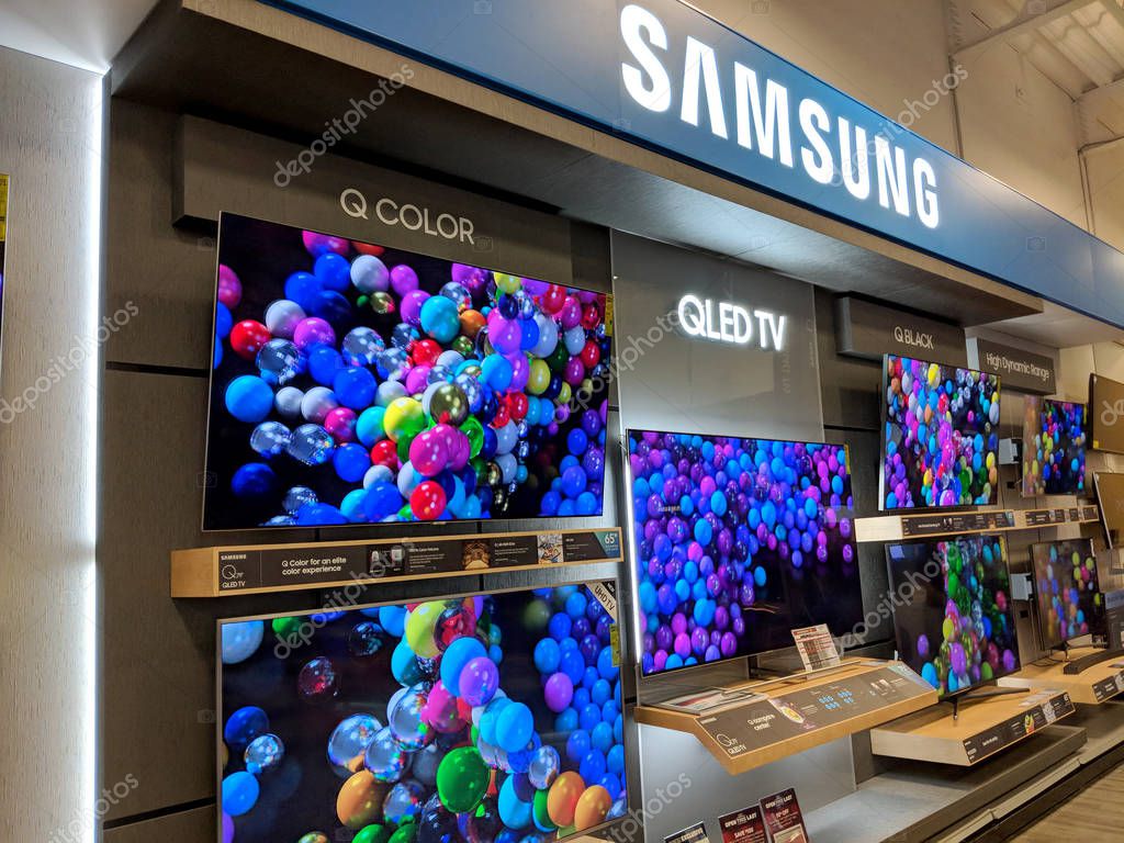 Honolulu - December 14, 2017: Samsung Logo and TV Display inside Best Buy Store.  Samsung is a South Korean multinational conglomerate headquartered in Samsung Town, Seoul. It comprises numerous affiliated businesses, most of them united under the Sa