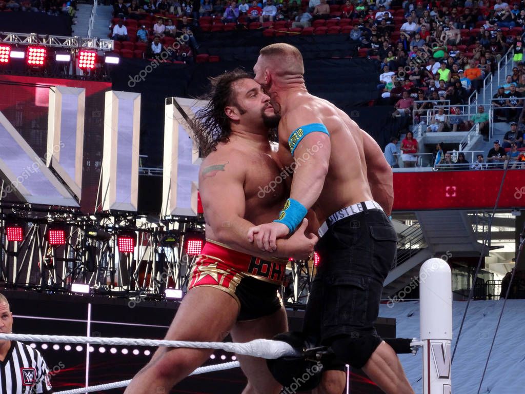 SANTA CLARA - March 29, 2015: WWE Wrestler John Cena and Rusev battle on the top of the ropes in the corner of ring during wrestling match for USA Championship title match at Wrestlemania 31 at the Levi's Stadium in Santa Clara, California on March 2