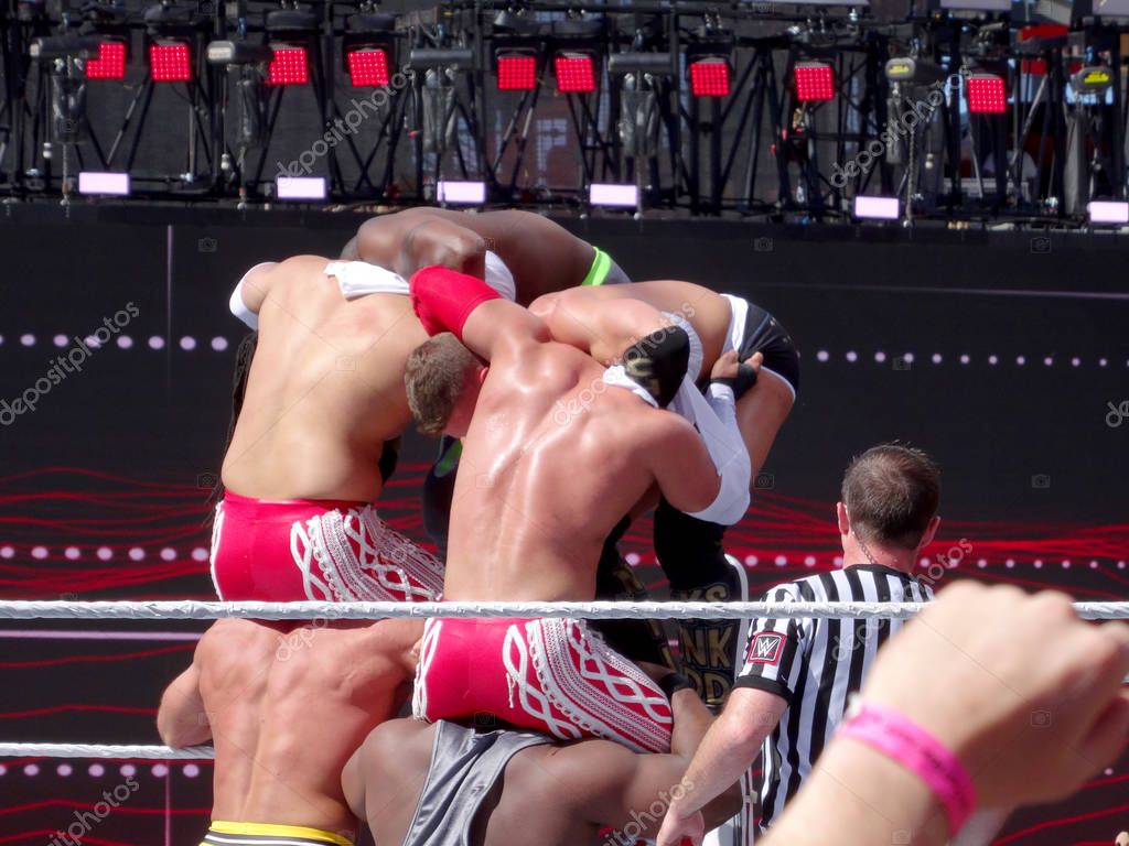 SANTA CLARA - MARCH 29: WWE wrestlers, Cesaro, Big E, los matadores, Tyson Kidd, Kofi Kingston setup for six man suplex from top turnbuckle during tag team championship match at Wrestlemania 31 pre show at the Levi's St