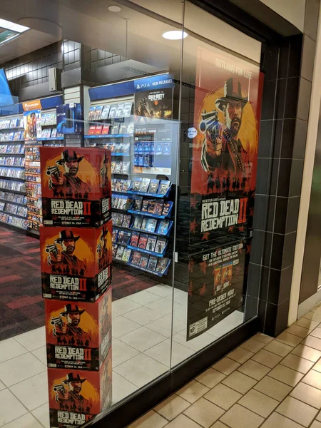 Red Dead Redemption 2 display in Gamestop store window — Stock Photo, Image