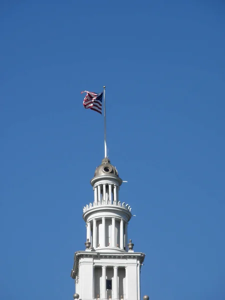 Ferry Building Clock Tower with flag waving on top — Stock Photo, Image